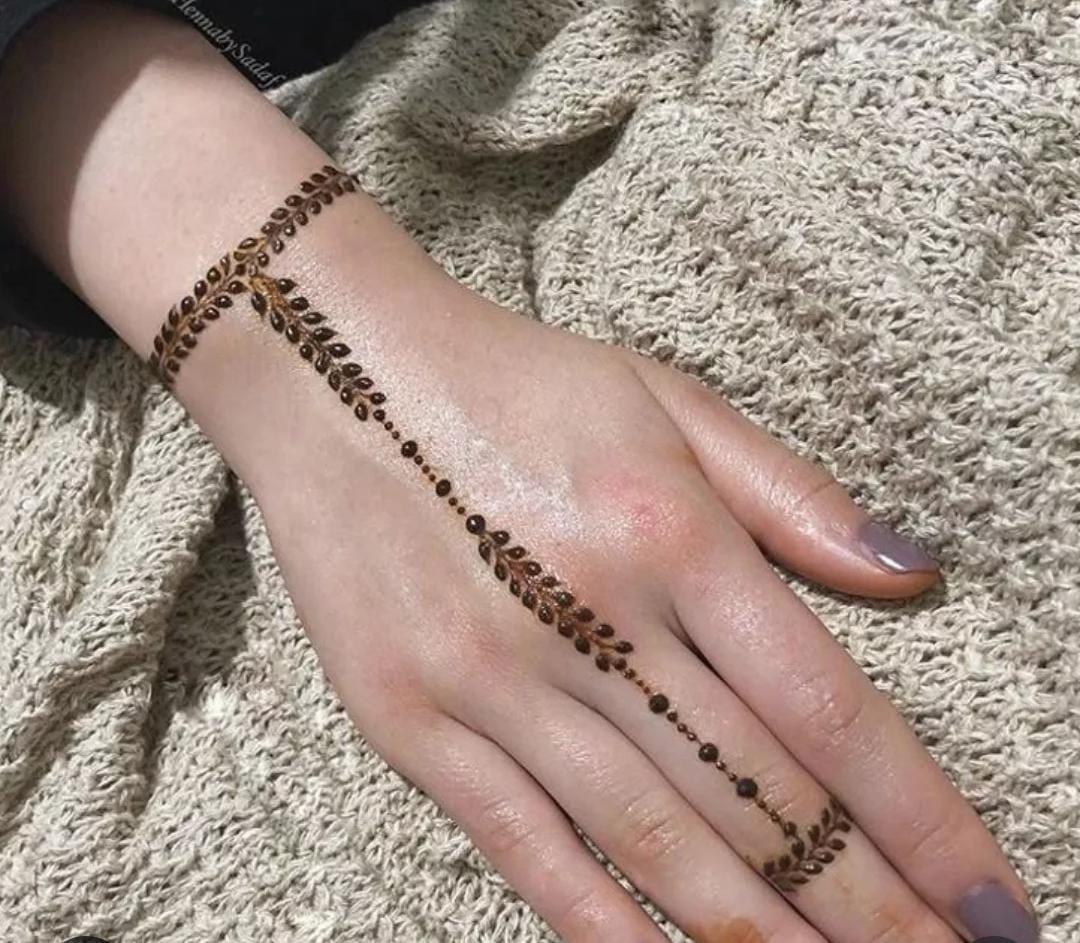 Engagement Mehndi design with bracelet-like patterns